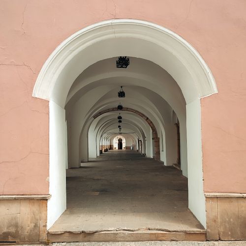 Free Beautiful indoor arched passageway in Poland showcasing historical architecture. Stock Photo
