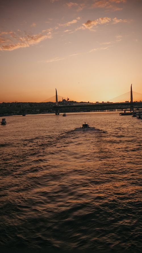 Free Breathtaking sunset and serene sea view with the Halic Bridge in Istanbul, Turkey. Stock Photo