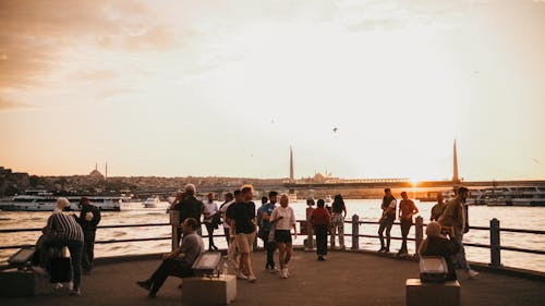 People on Sea Coast in Istanbul at Sunset