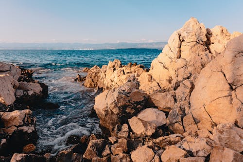 Free Body of Water and Rock Formation Stock Photo