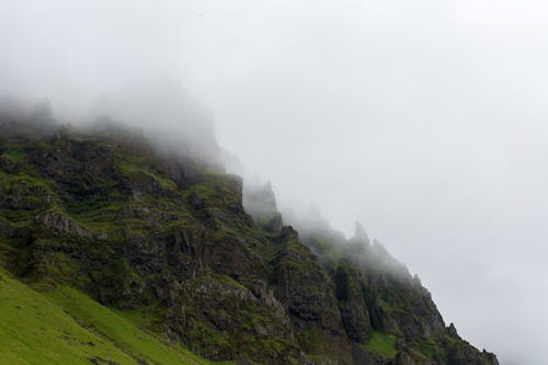 Mountain Landscape with Rocky Cliffs Hidden by Fog