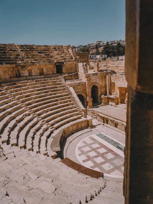 Free Explore the stunning ruins of the ancient Roman amphitheater in Jerash, Jordan. Stock Photo