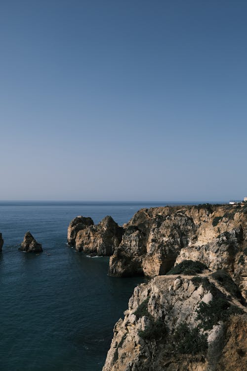 Placid Seascape with Rocky Cliffs at an Ocean Shore, Lagos, Portugal