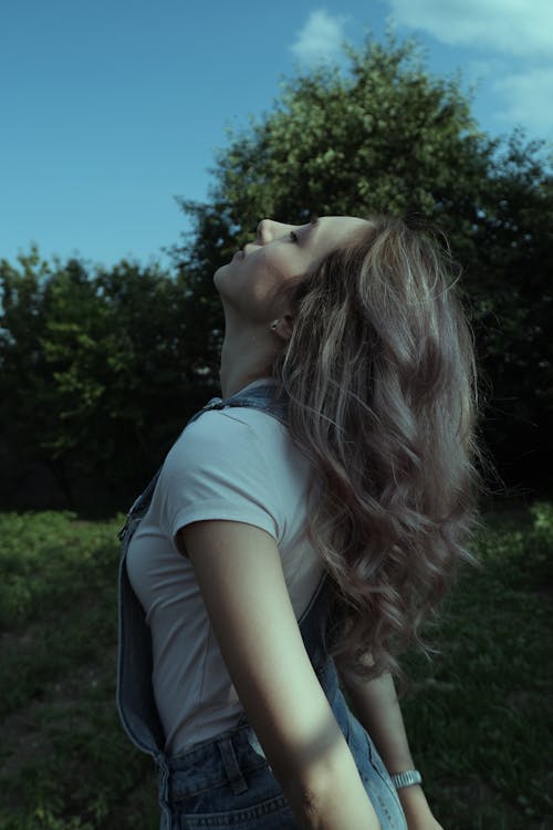 Woman Standing with Eyes Closed