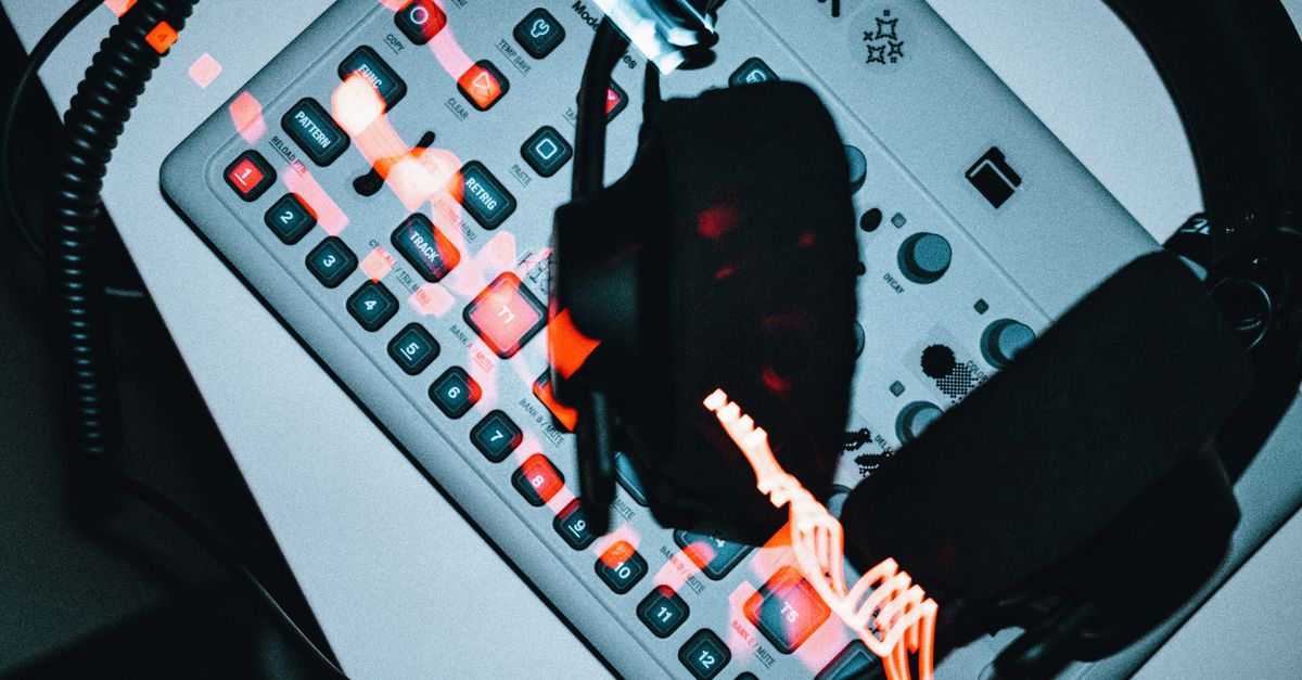 High-angle view of a groovebox with headphones, showcasing modern electronic music production.