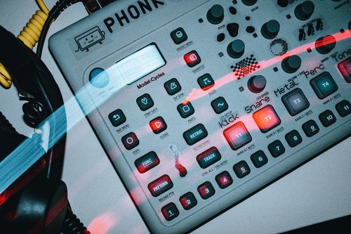 Free Close-up of a synthesizer console with glowing buttons and retro design. Stock Photo