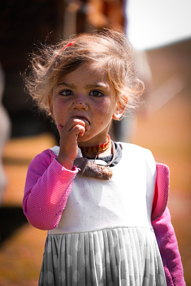 Cute Child In Dress On Street