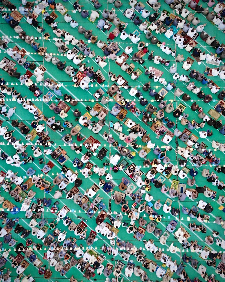 People Praying On Floor In Mosque