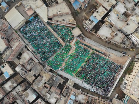 A captivating aerial view showcasing a large Eid prayer gathering in Qashtoukh, Egypt.