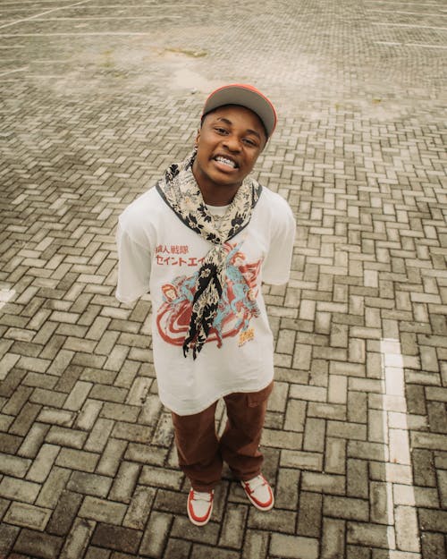 Young Man in a Trendy Outfit Posing Outdoors 