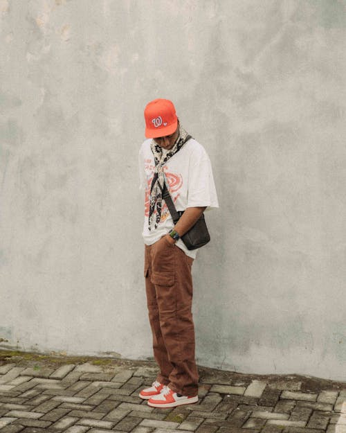 Young Man in a Trendy Outfit Posing Outdoors 