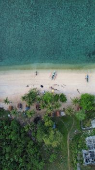 Stunning aerial shot of Pagbilao beach with lush greenery and clear blue waters.