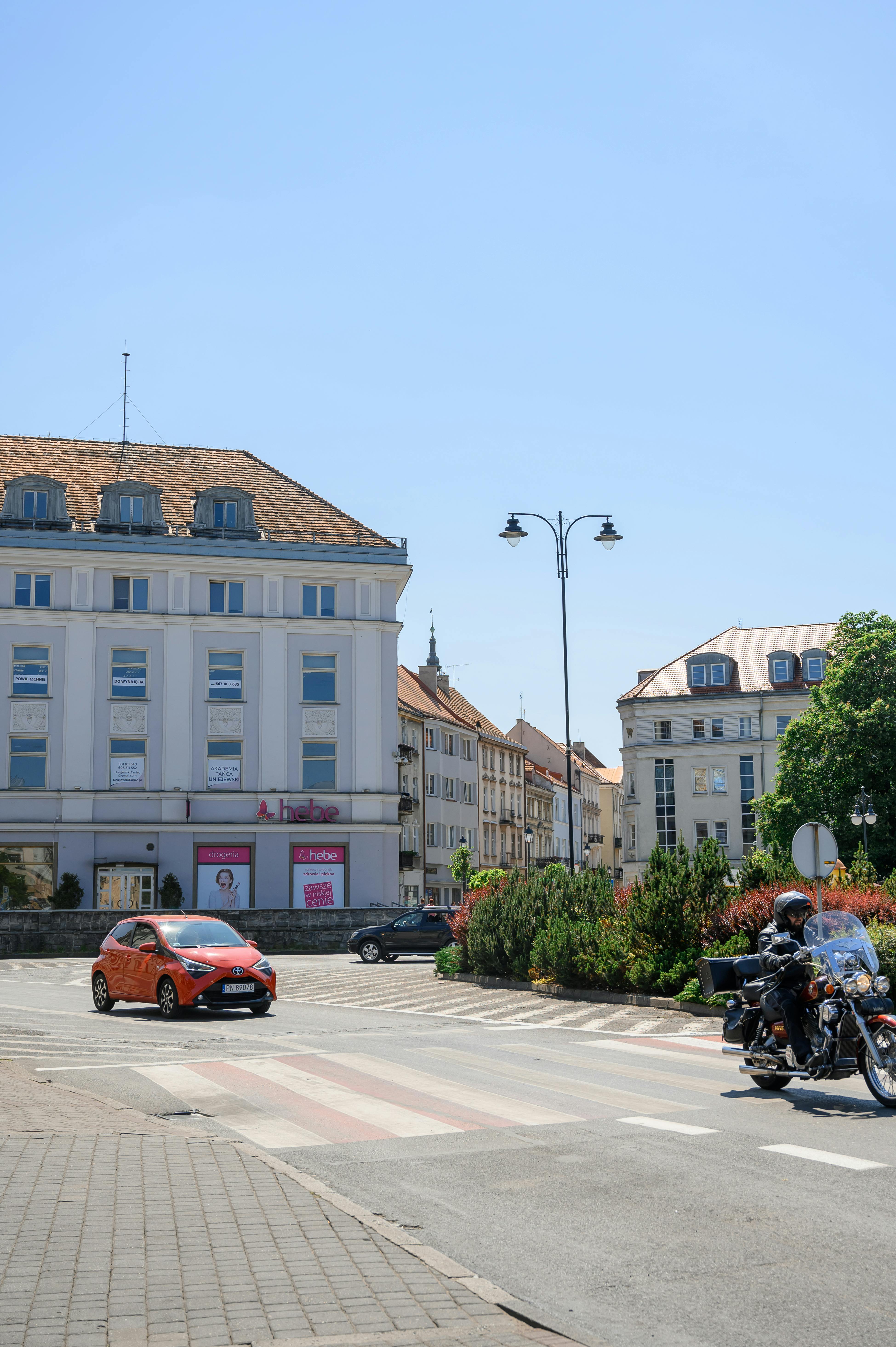 City street view featuring architecture and vehicles in daylight.