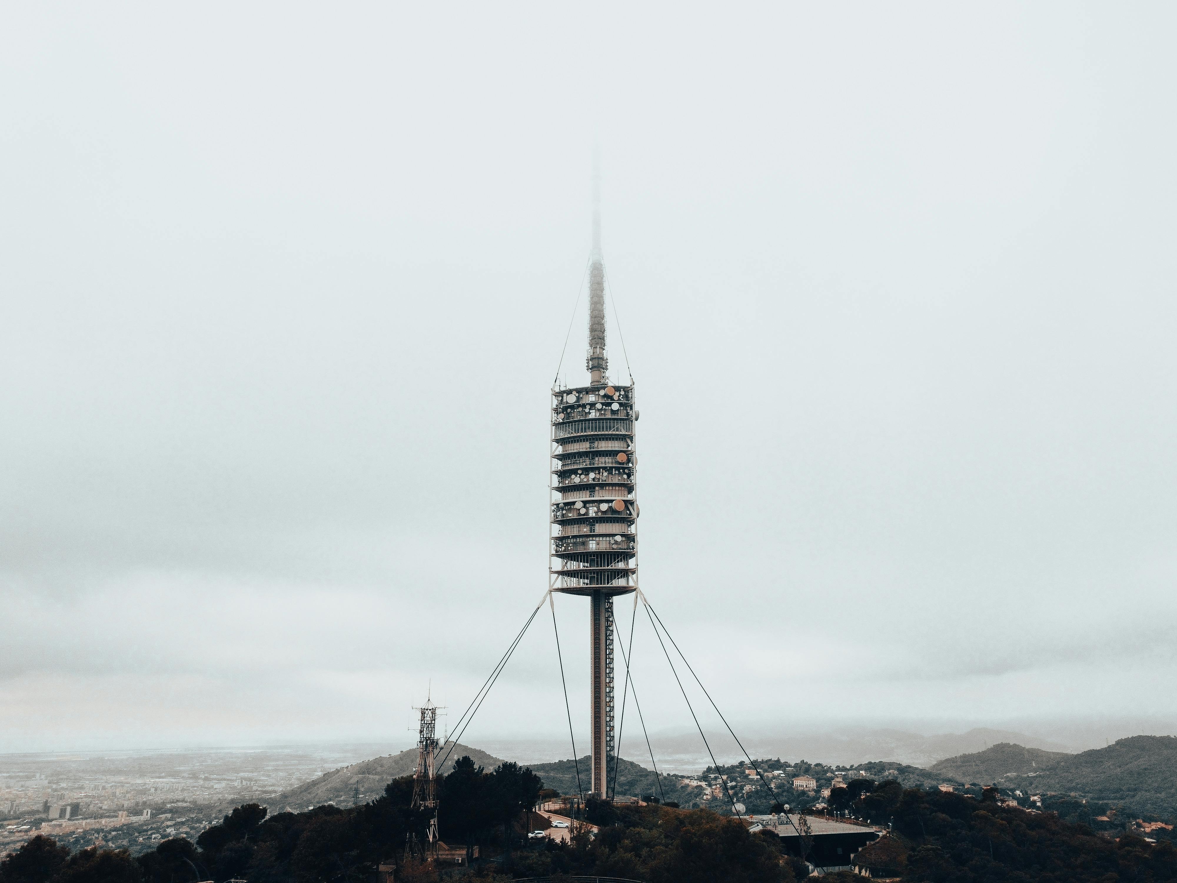 fog over collserola tower in barcelona