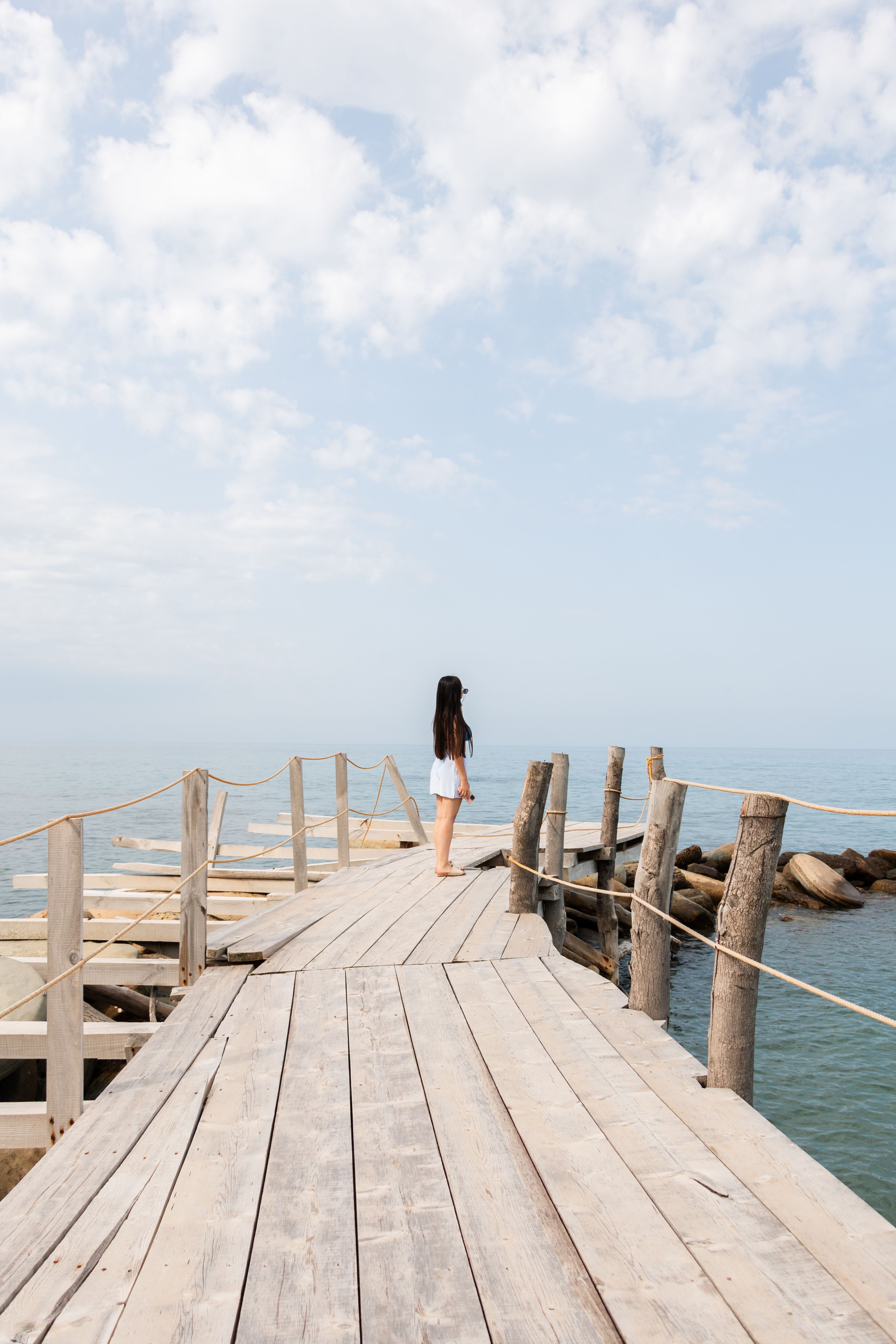 Woman on a Wooden Pier by the Sea · Free Stock Photo