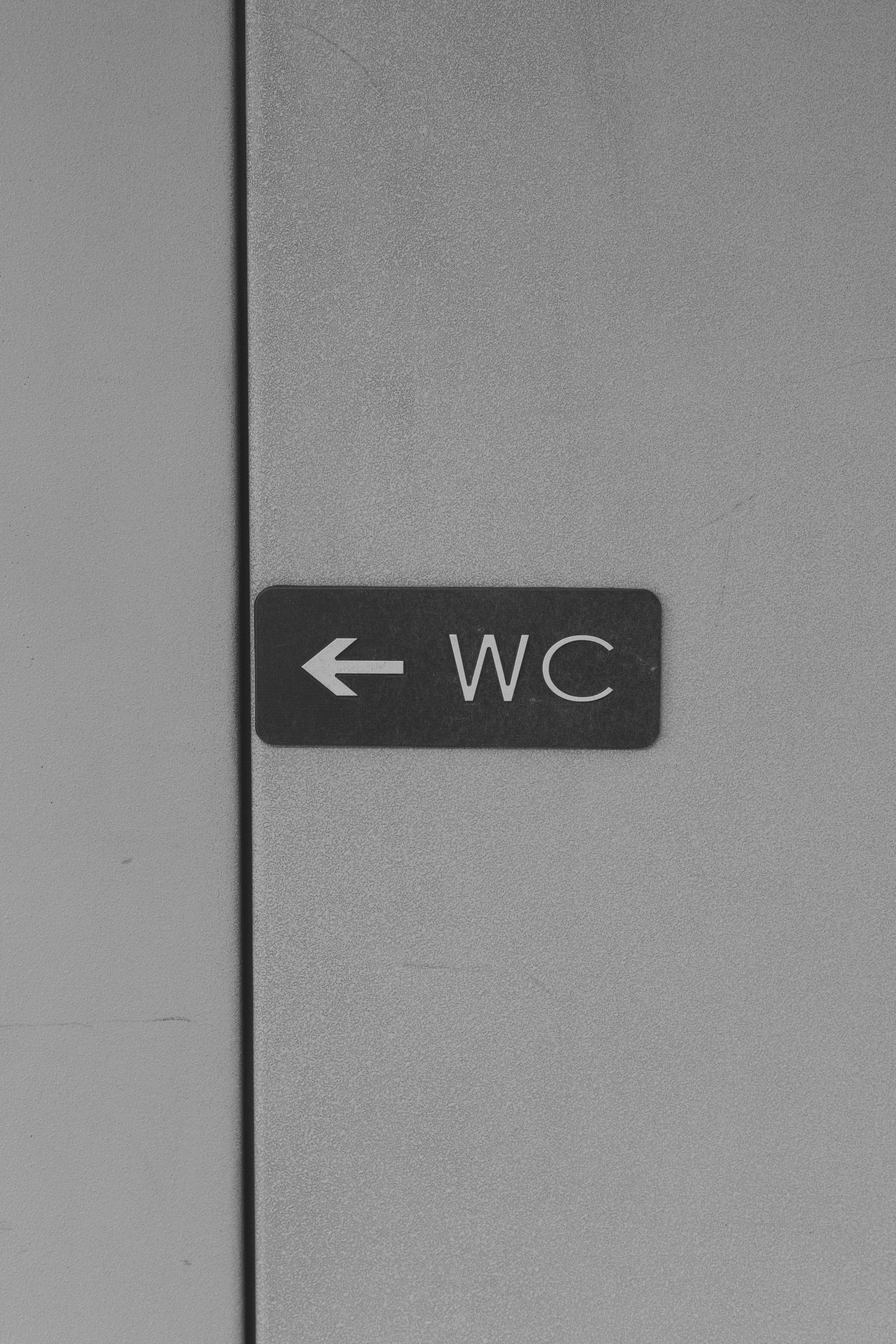 WC Sign on Wall · Free Stock Photo