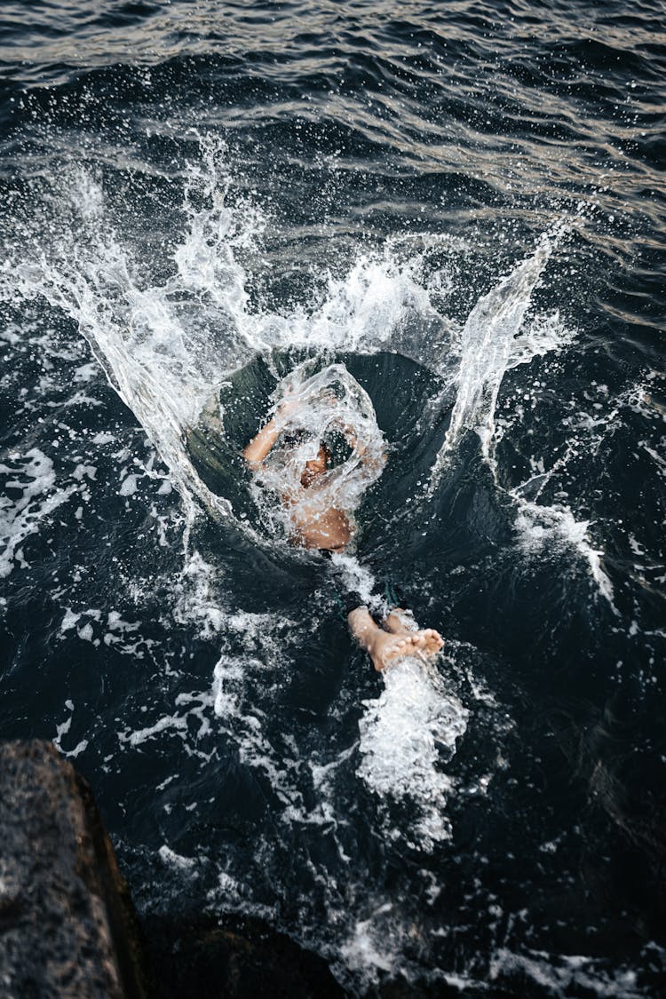 Man Jumping Into Sea Water 