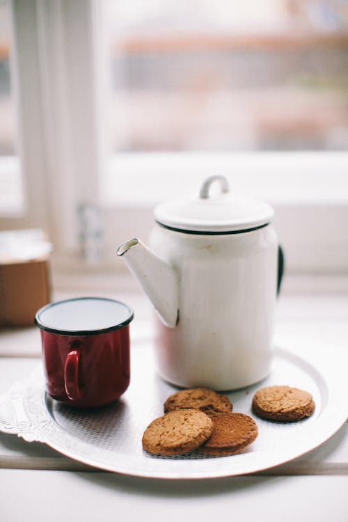 Free White Teapot, Red Mug And Cookies Stock Photo