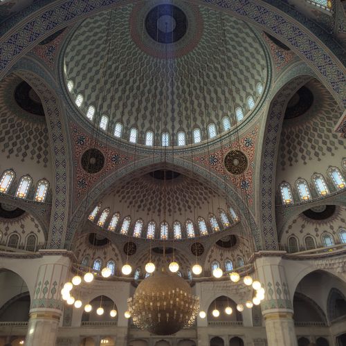 Free A stunning view of the ornate dome and chandelier inside the Kocatepe Mosque in Turkey. Stock Photo