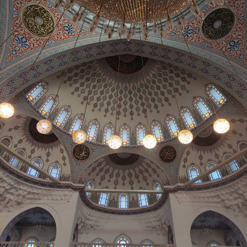 Free Interior view of the magnificent dome in Kocatepe Mosque, showcasing Islamic art and architecture. Stock Photo