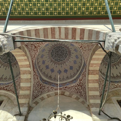 Free Explore the ornate ceilings and arches of Ottoman architecture in Istanbul. Stock Photo