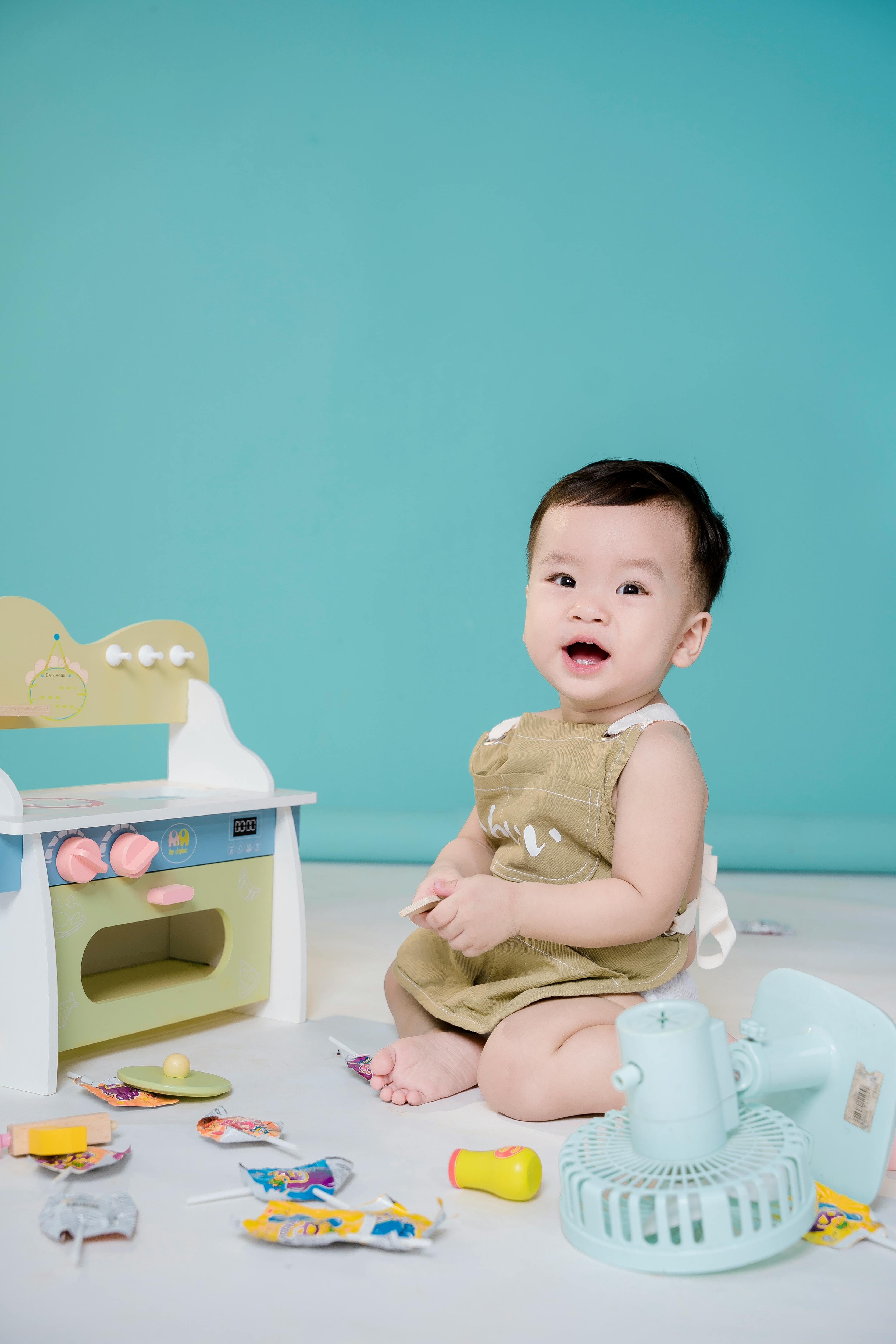 little boy playing with toys