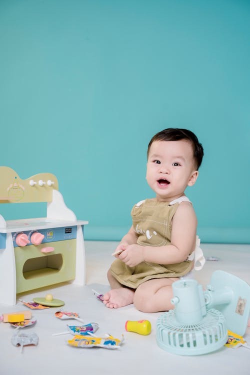 Little Boy Playing with Toys