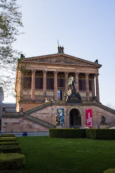 Capture of Berlin's iconic Alte Nationalgalerie on a sunny day, showcasing its grandeur and architectural beauty.