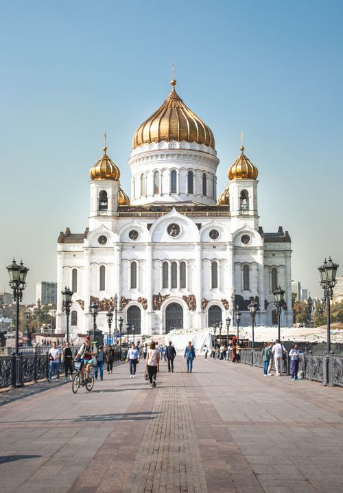 Free People walking near the stunning Cathedral of Christ the Saviour in Moscow, showcasing its golden domes and classic architecture. Stock Photo