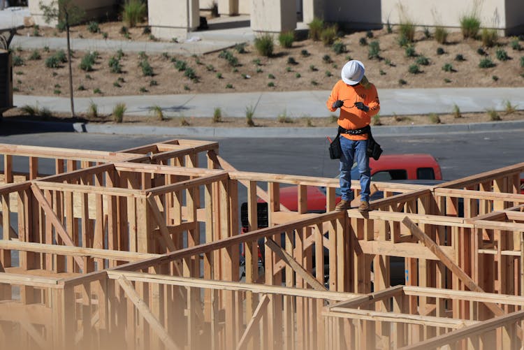 Man Standing On House Construction