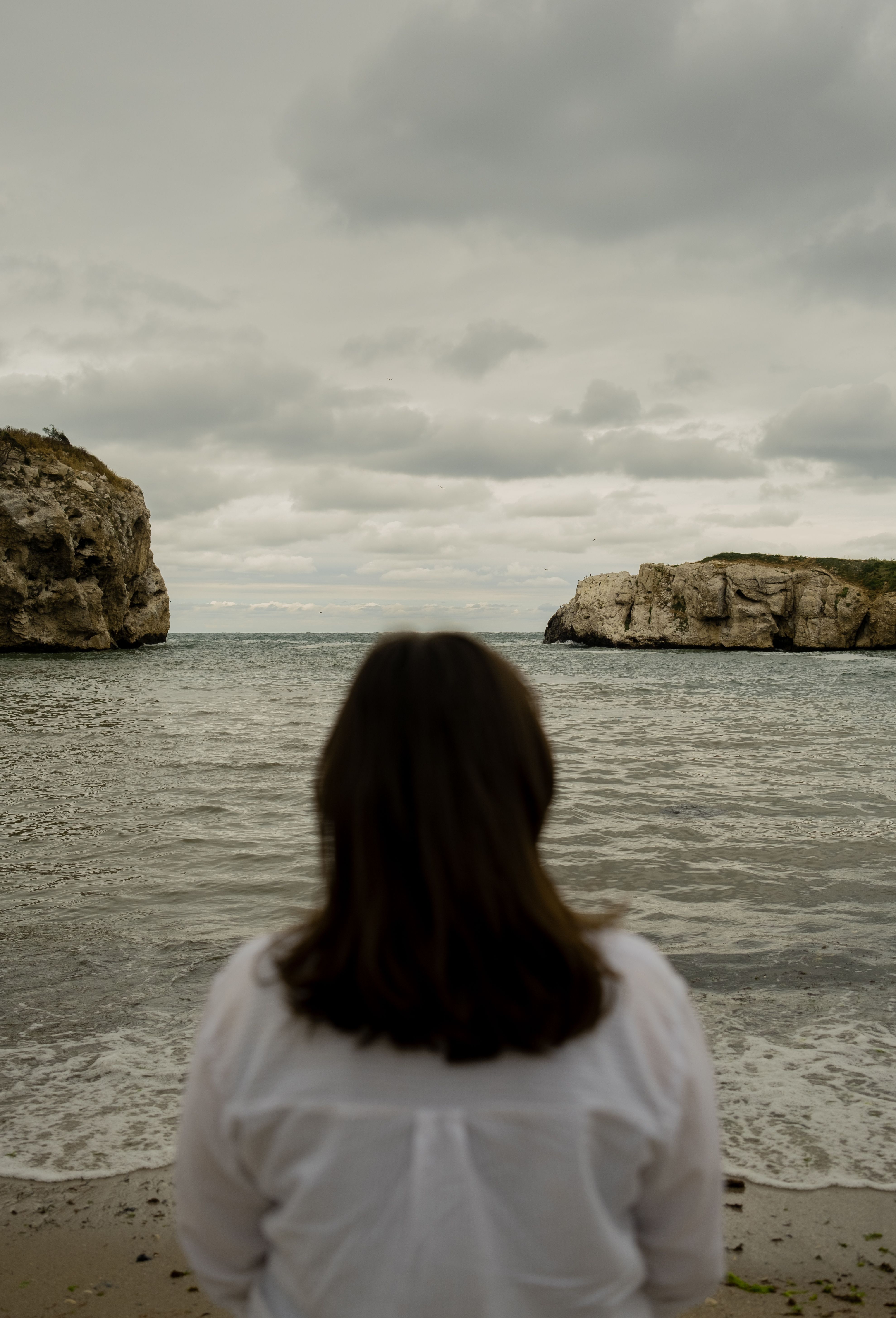 Back of a Woman Looking at the Sea · Free Stock Photo