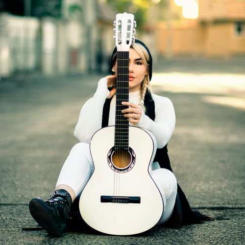 Guitarist playing at golden hour by Mohammadreza Merhvand on Pexels