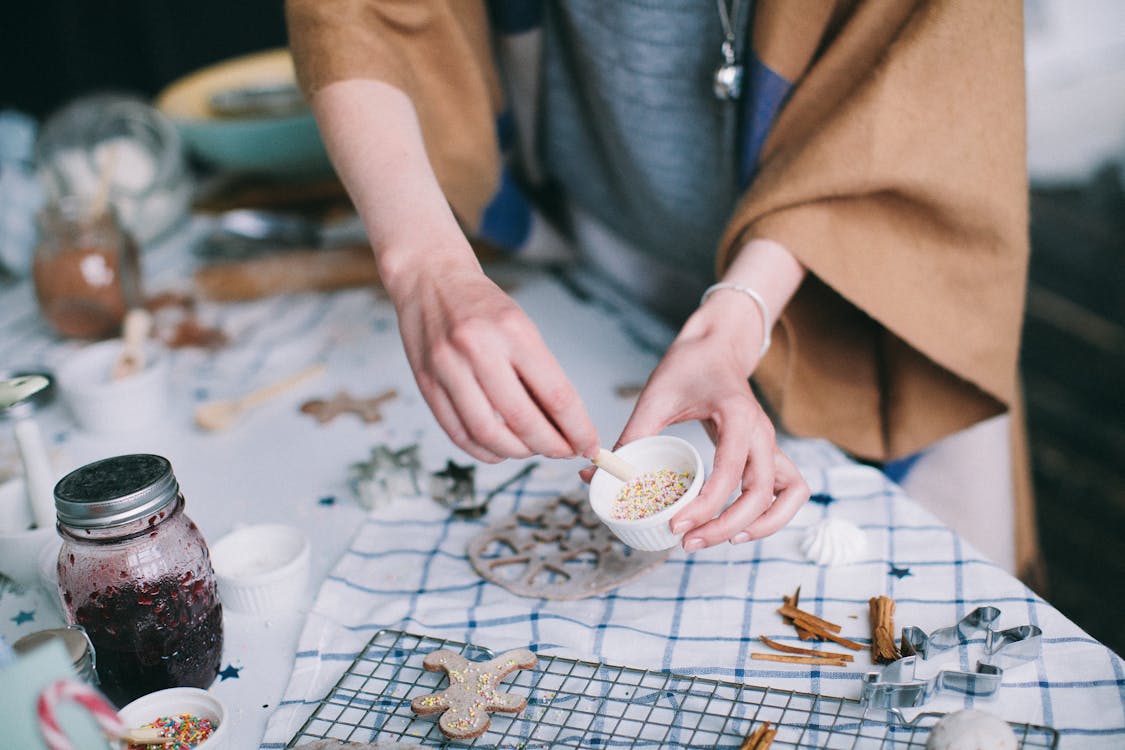 Free Gingerbread on Grill Grate Near Jar of Jam on Table Stock Photo