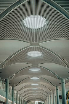 Modern and futuristic ceiling design of Istanbul airport terminal, showcasing architectural innovation.