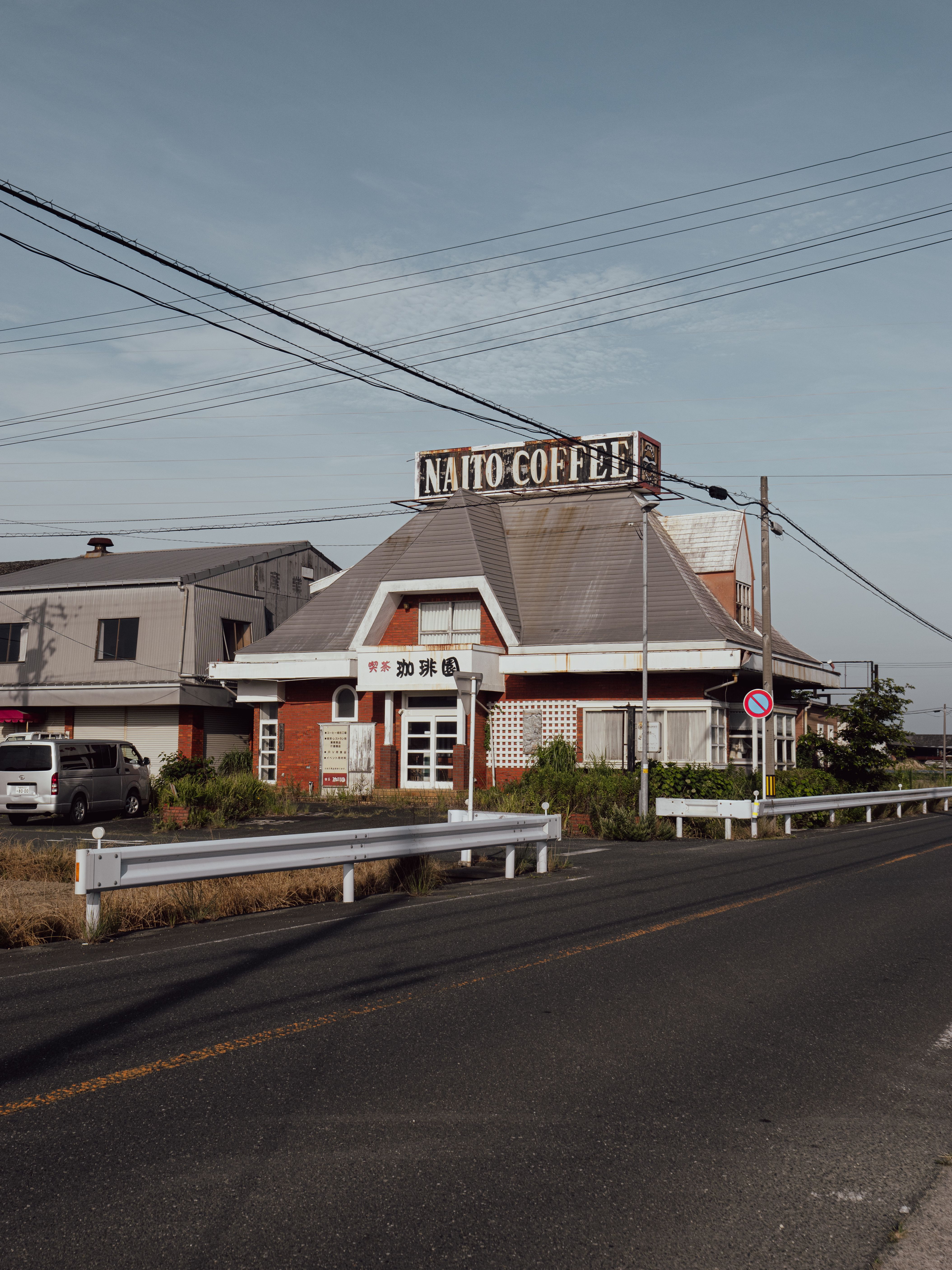 Exterior view of a vintage café in rural Toyohashi, showcasing classic architecture.