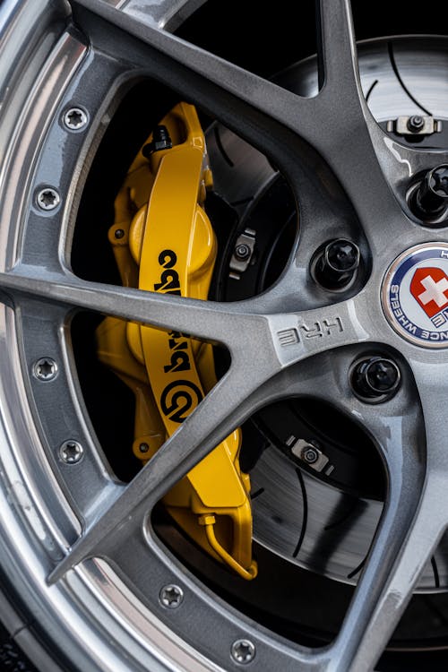 Close-up of a Car Wheel with a Yellow Brake Caliper