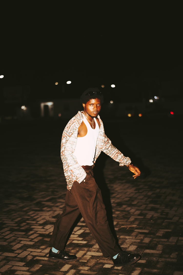 Man Walking And Posing At Night