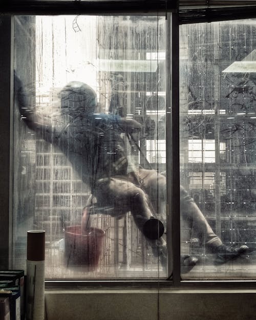 Man Cleaning Window 