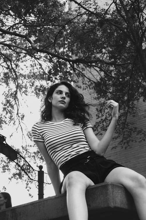 Woman in a Striped T-Shirt and Shorts 