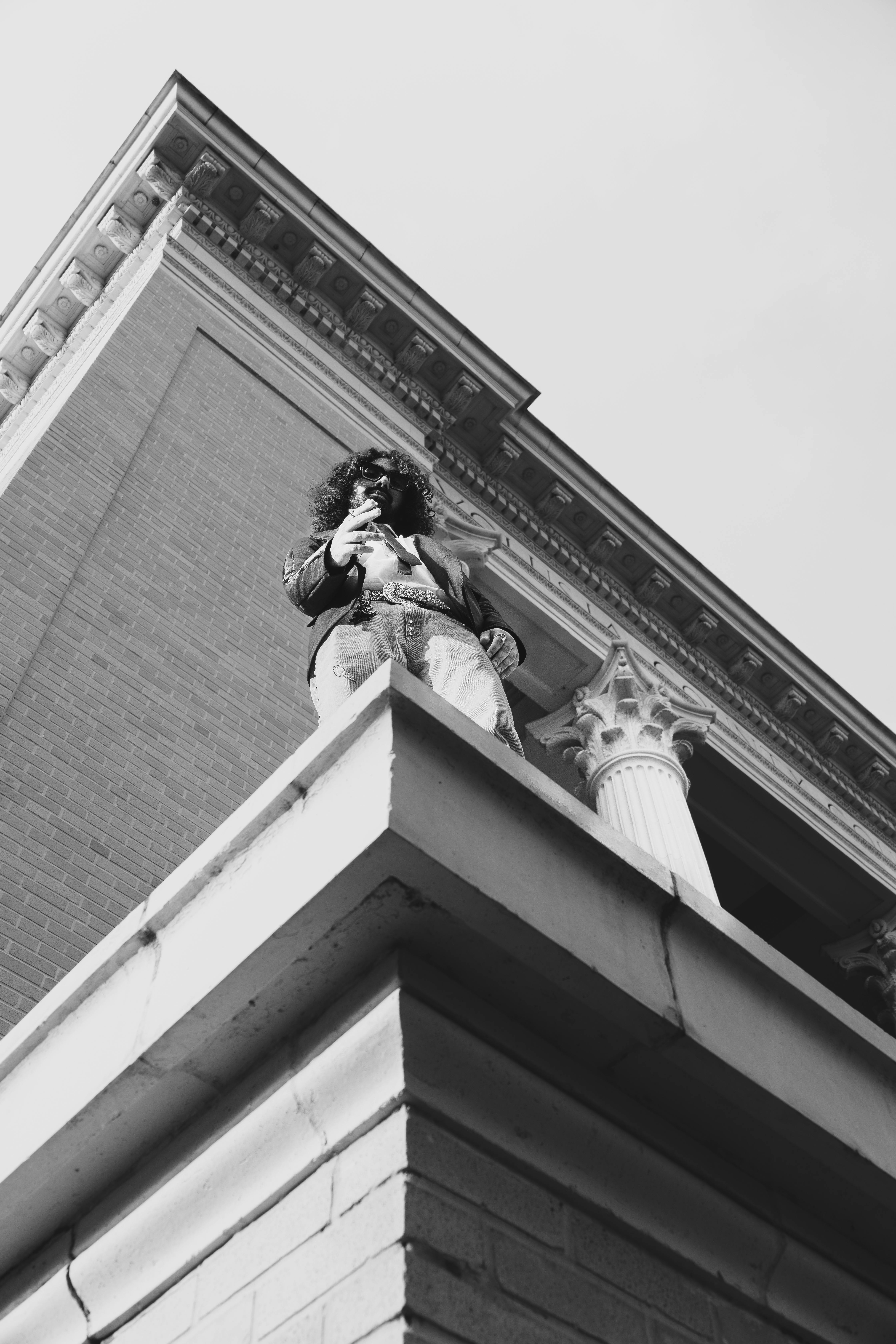 Man Standing on the Corner of a Building · Free Stock Photo