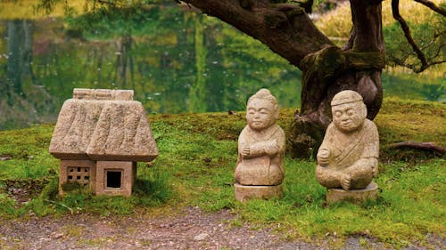 Little Buddha Figures in Garden