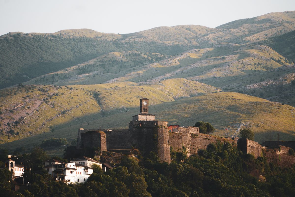 Gjirokastër Fortress rising above the Drino valley — one of the most dramatic castles in the Balkans.