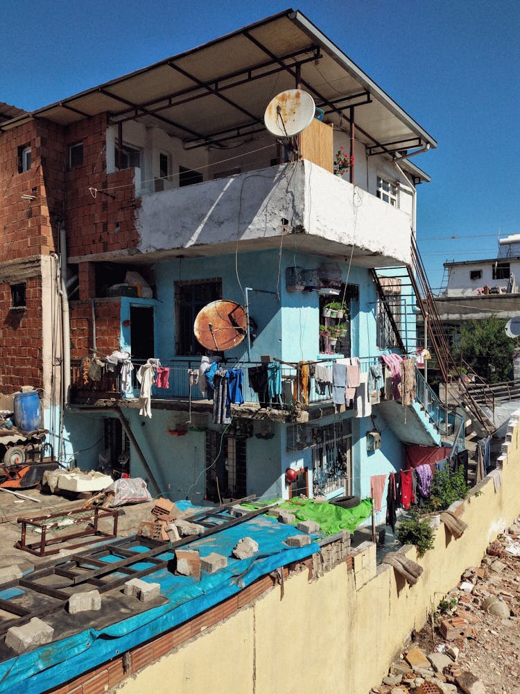 Clothes Drying On Damaged Building