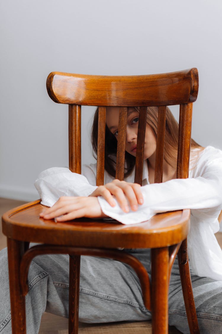 Girl Posing Behind Chair