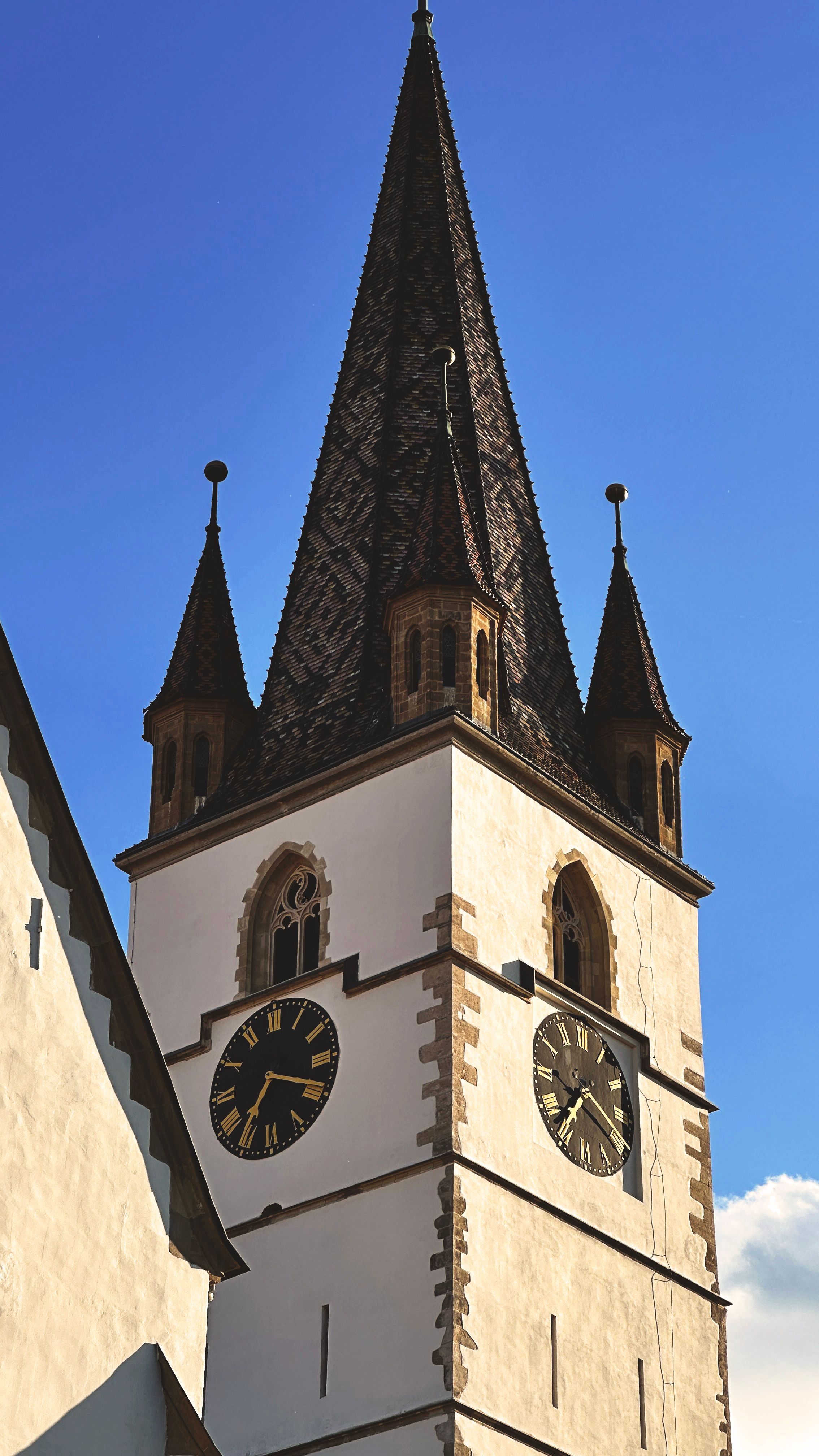 A church with a clock tower and a blue sky · Free Stock Photo