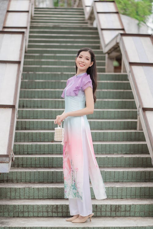 Young Elegant Woman Posing on Steps in City