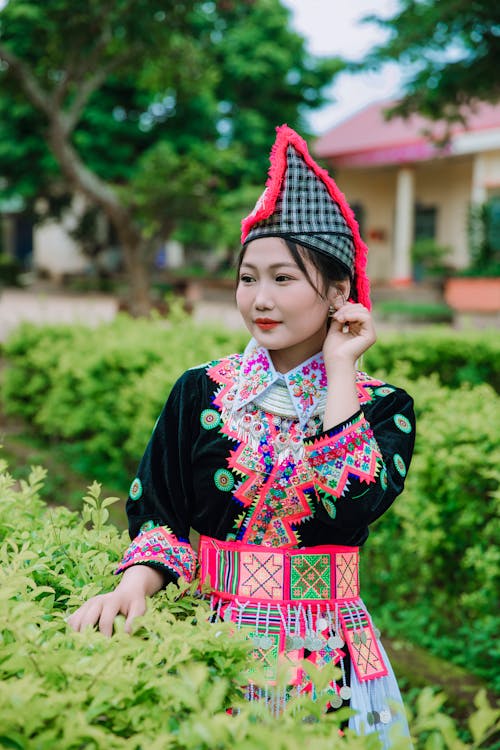Woman in Traditional Clothing and Hat