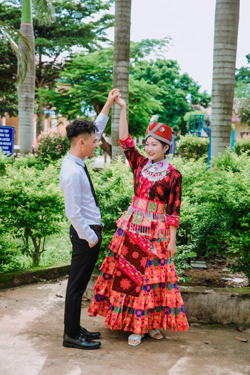 Man with Smiling Woman in Traditional Dress