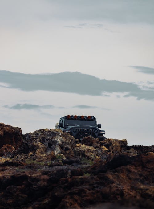 Jeep Wrangler behind Rocks