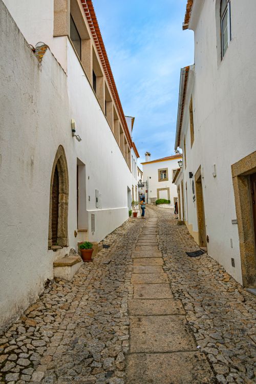 Free Explore the quaint cobblestone streets of Marvão, Portugal with whitewashed facades and historic charm. Stock Photo
